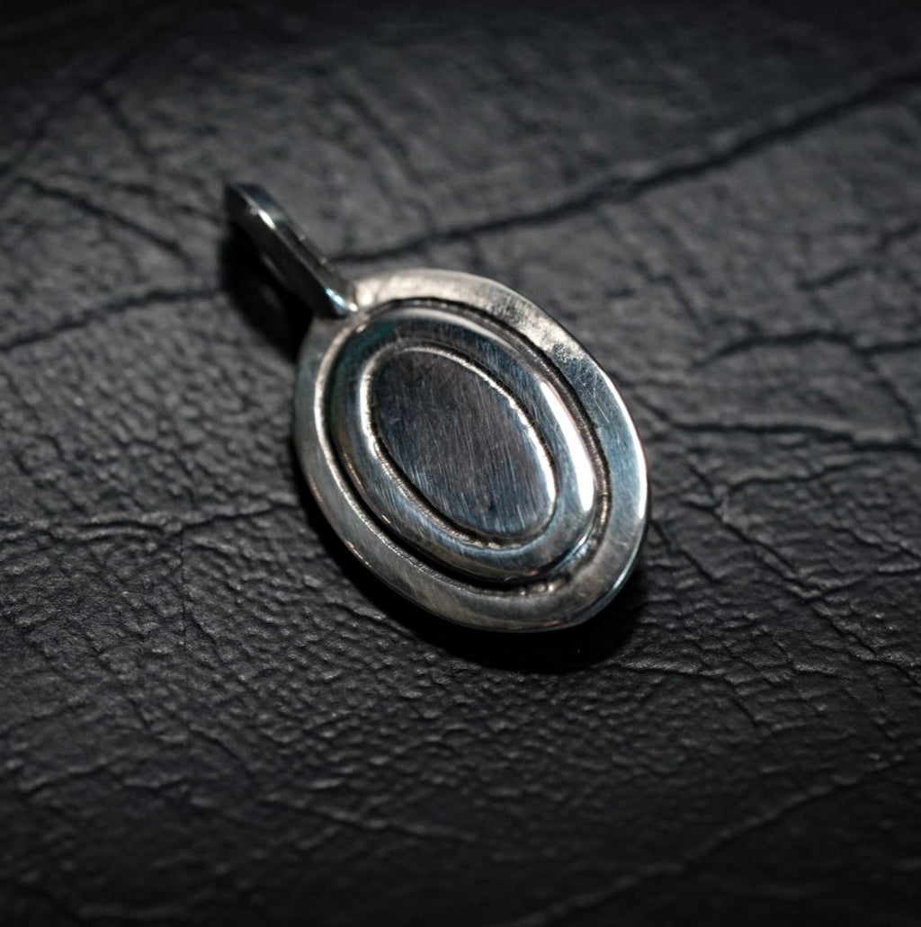 Oval Framed Skull Pendant